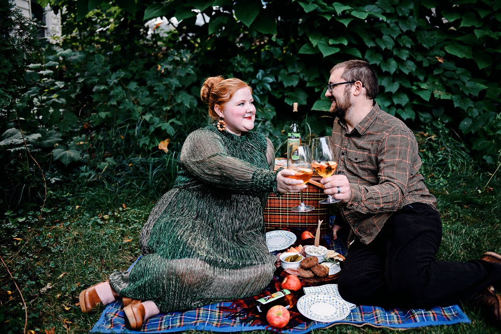 Everyday Magic: Fall Picnic. Fall picnic photoshoot inspiration, with tips for creating a fall cheeseboard to serve with Witches Brew Spiced Apple wine. #witchesbrew #applewine #fallpicnic #fallpicnicphotoshoot #fallcheeseboard #michiganwinery #michiganwine #leelanauwine #michiganblog #michiganinfluencer