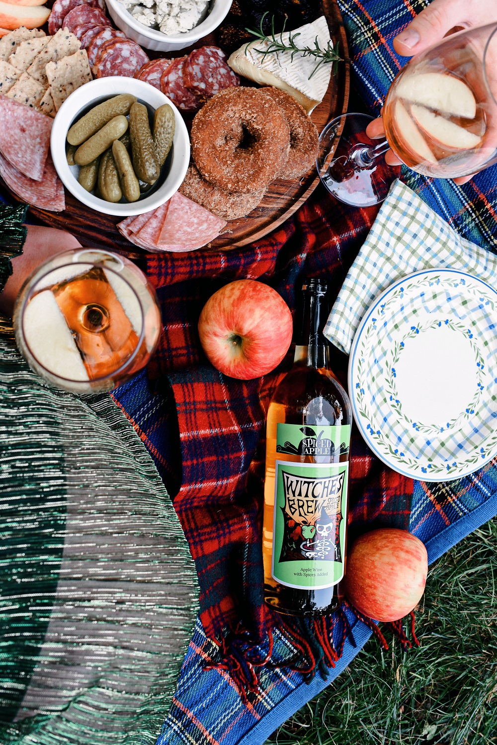 Everyday Magic: Fall Picnic. Fall picnic photoshoot inspiration, with tips for creating a fall cheeseboard to serve with Witches Brew Spiced Apple wine. #witchesbrew #applewine #fallpicnic #fallpicnicphotoshoot #fallcheeseboard #michiganwinery #michiganwine #leelanauwine #michiganblog #michiganinfluencer