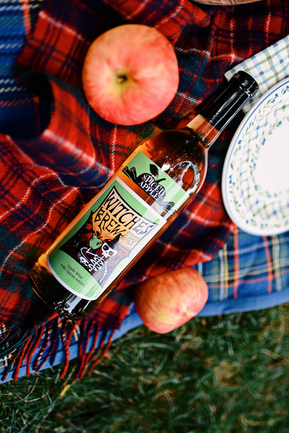 Everyday Magic: Fall Picnic. Fall picnic photoshoot inspiration, with tips for creating a fall cheeseboard to serve with Witches Brew Spiced Apple wine. #witchesbrew #applewine #fallpicnic #fallpicnicphotoshoot #fallcheeseboard #michiganwinery #michiganwine #leelanauwine #michiganblog #michiganinfluencer