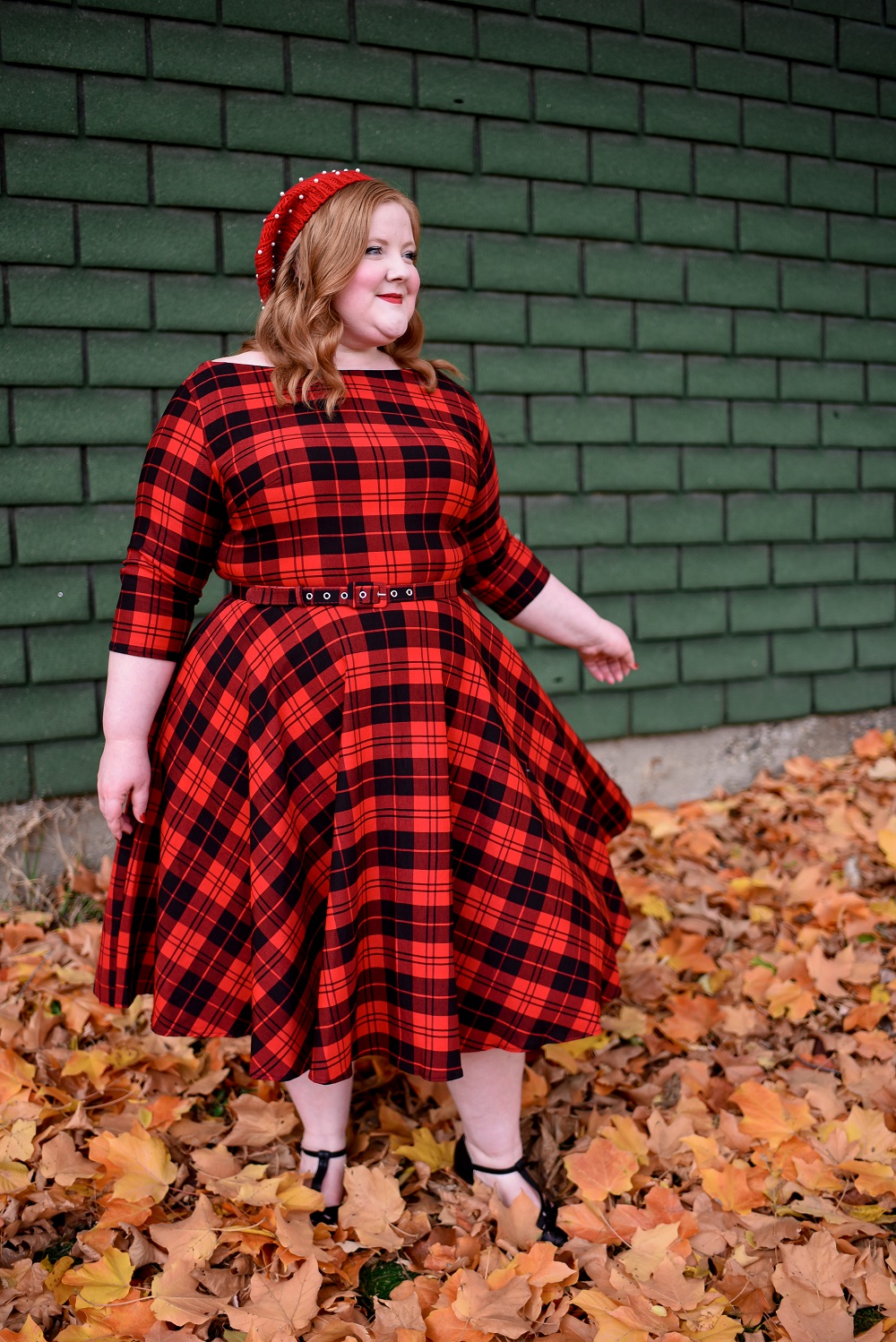 The Perfect Red Plaid Dress: the plus size Devon Swing Dress from Unique Vintage styled for holiday and Christmas with a red pearl beret and black T-straps. #uniquevintange #plaiddress #redplaiddress #redberet #pearlberet #fallleavesphotoshoot #fallleaves #autumnleaves
