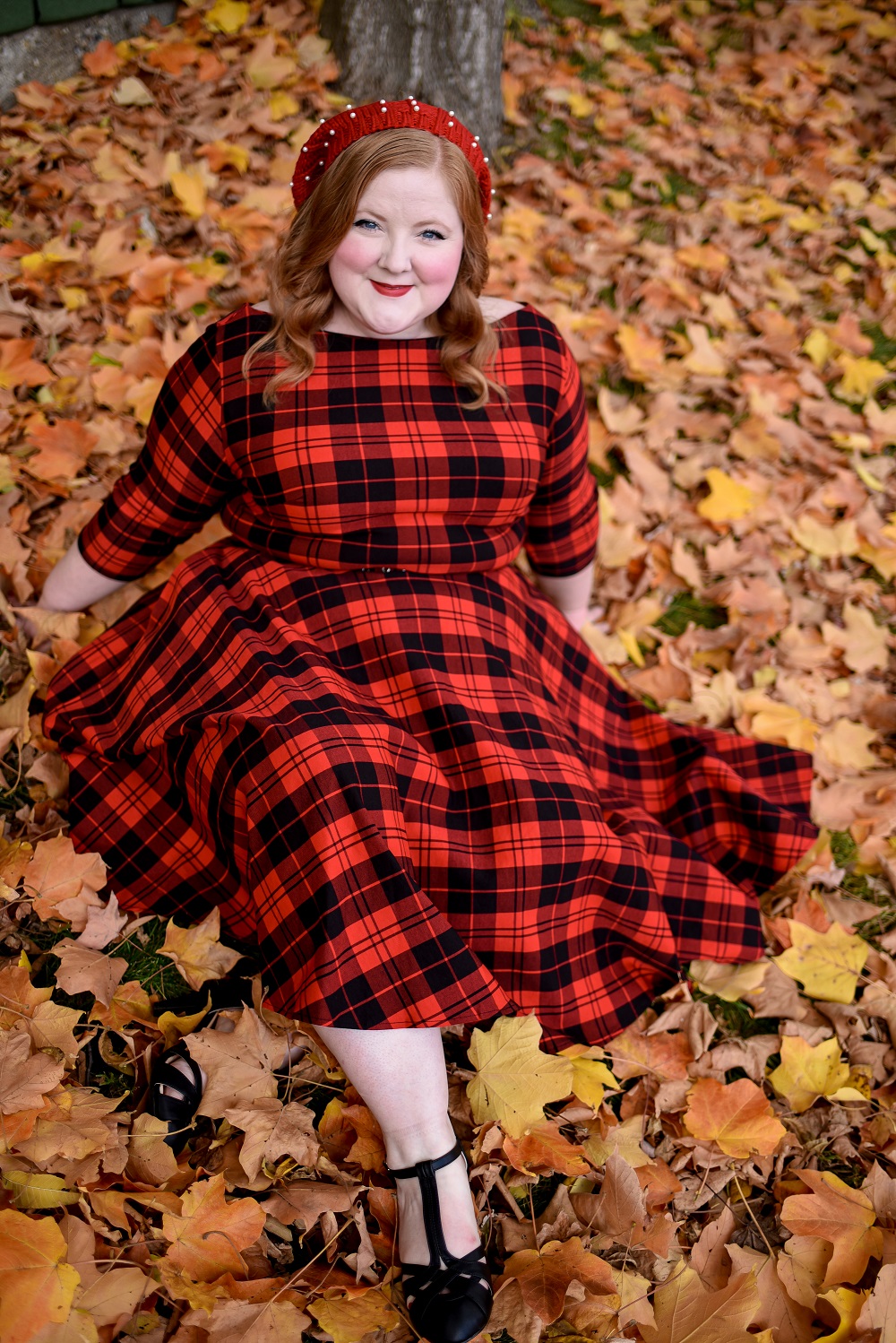 The Perfect Red Plaid Dress: the plus size Devon Swing Dress from Unique Vintage styled for holiday and Christmas with a red pearl beret and black T-straps. #uniquevintange #plaiddress #redplaiddress #redberet #pearlberet #fallleavesphotoshoot #fallleaves #autumnleaves