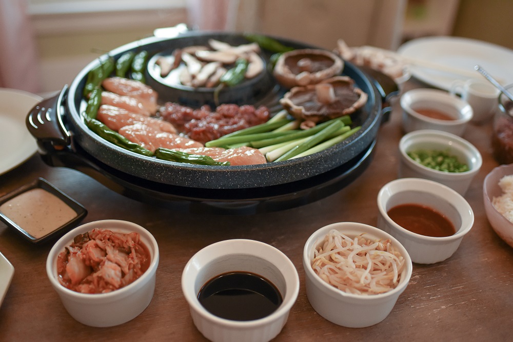 Korean-Style BBQ at Home: gather around the table for a special family dinner and graze as you cook with this tabletop grill from ShopLC.com. #tabletopgrill #shoplc #weshoplc #deliveringjoy #grillnight #koreanbbq #koreanstylebbq