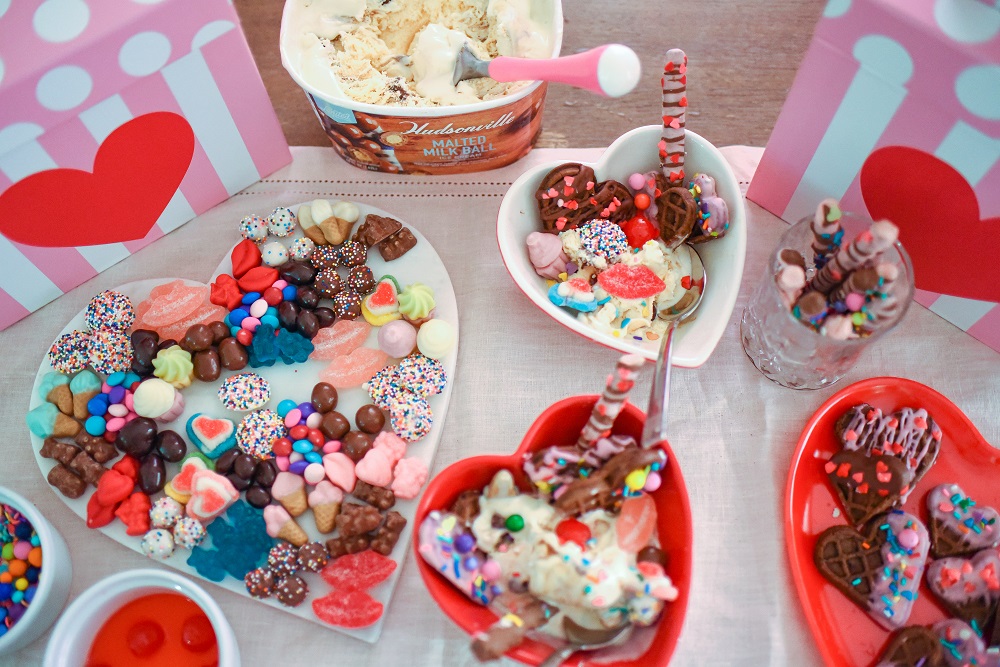 Valentine's Day Waffle Sundaes with Hudsonville Malted Milk Ball Ice Cream. A creative and colorful ice cream sundae bar for Valentine's! #valentinesday #valentinesdayrecipe #valentinesdaydessert #icecreamsundae #sundaebar #hudsonvilleicecream