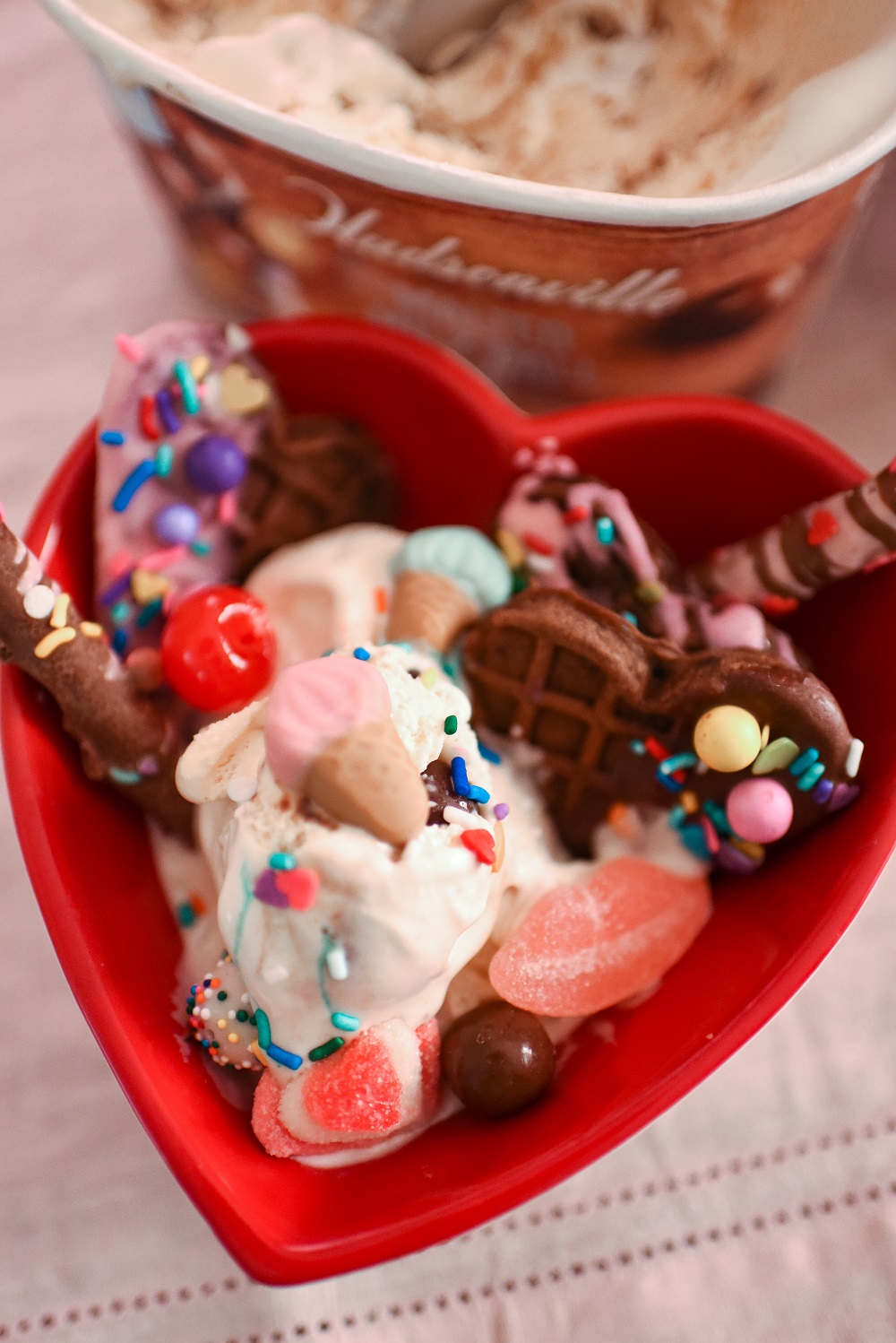 Valentine's Day Waffle Sundaes with Hudsonville Malted Milk Ball Ice Cream. A creative and colorful ice cream sundae bar for Valentine's! #valentinesday #valentinesdayrecipe #valentinesdaydessert #icecreamsundae #sundaebar #hudsonvilleicecream