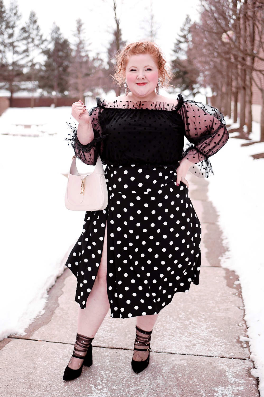 Polka Dots, Ruffles, and Tulle: A cute plus size polka dot outfit from ELOQUII, with French and Ford bow earrings and a Gucci Jackie 1961 bag. #eloquii #xoq #frenchandford #bowearrings #guccijackie #guccijackiebag #guccijackie1961 #plussizeoutfit #plussizefashion #plussizestyle