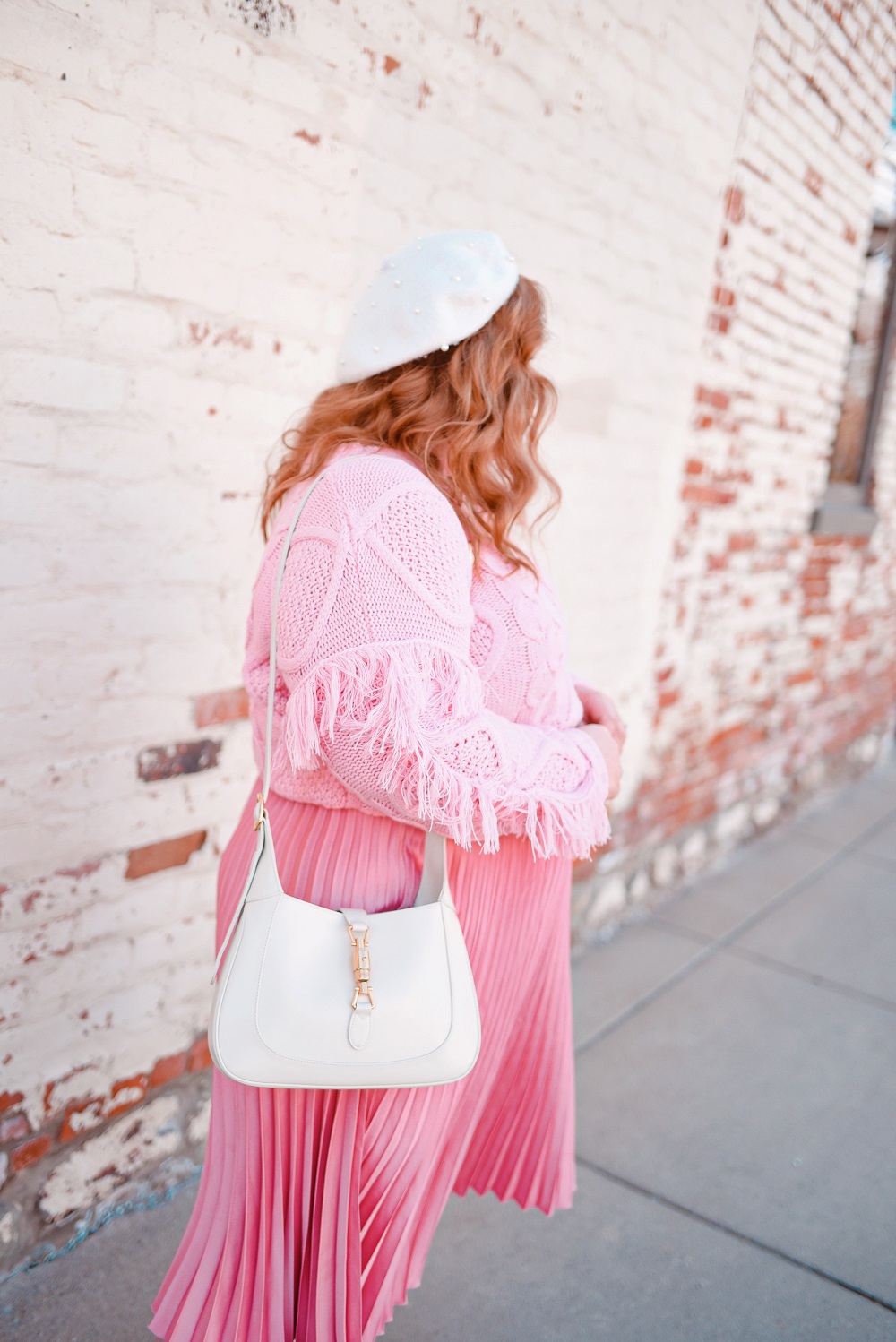 A Pretty in Pink Outfit for the Spring Transition: Mint Julep Boutique sweater, H&M skirt, Gucci Jackie 1961 bag, and Marc Fisher boots. #shopthemint #mintjulepboutique #guccijackie1961 #plussizefashion #plussizestyle