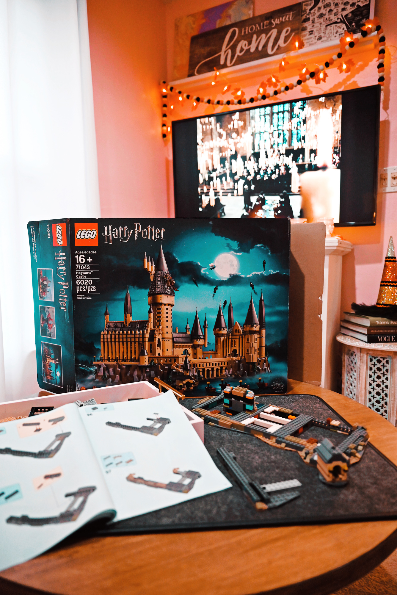 Gift Ideas for Harry Potter Lovers: shop this Hogwarts house sweater, book boxed sets, LEGO Hogwarts castle, HP graphic tees, and bath bombs.