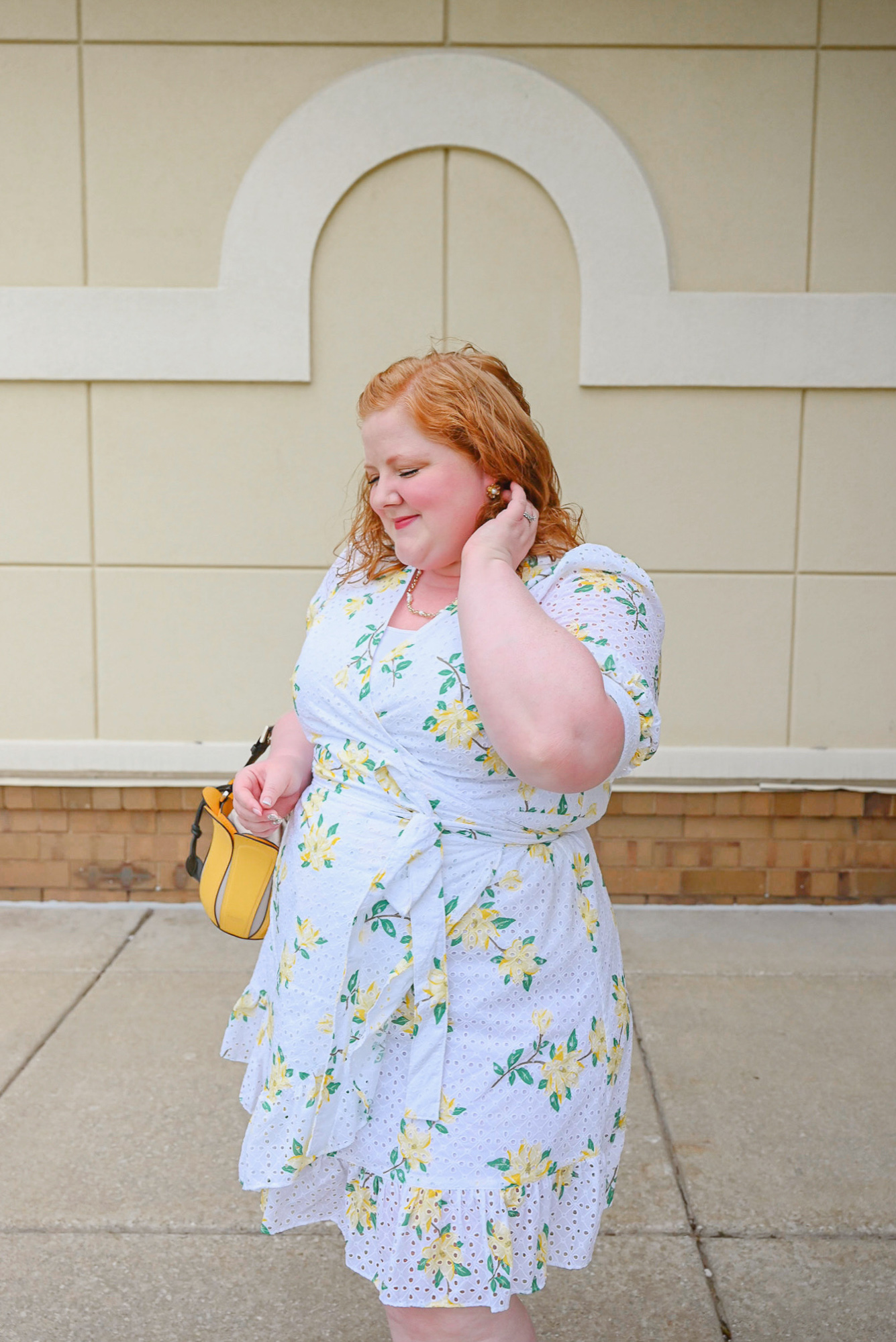 Preppy Summer Style with Draper James | Style the DJ Reba Wrap Dress in Magnolia Eyelet with pearl jewelry, a yellow bag, and flat white sandals.