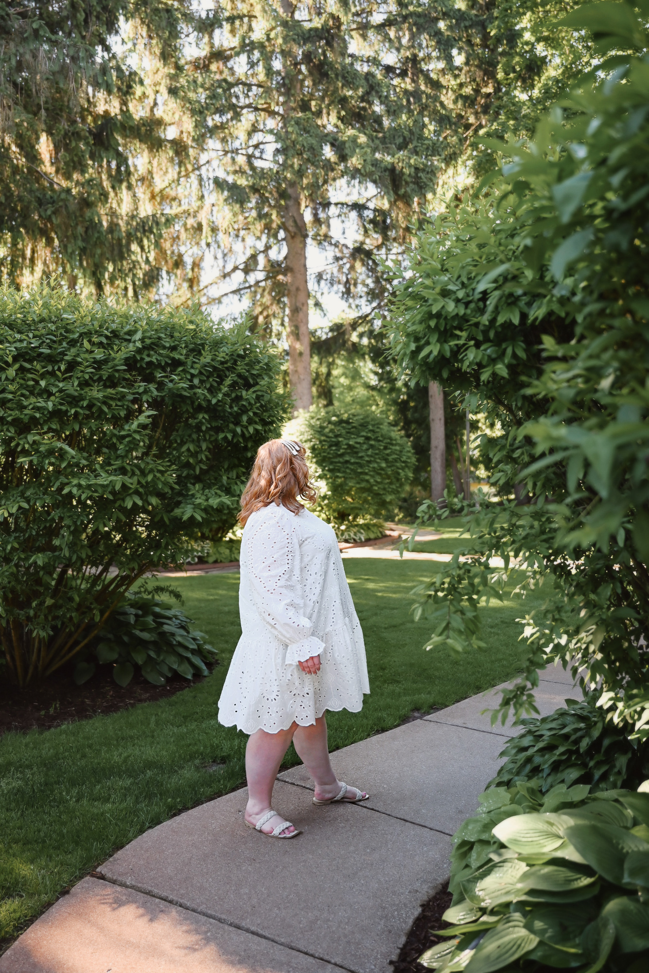 The Easy Eyelet Dress from ELOQUII | This mini dress comes in 4 colors in sizes 14-28: white, black, powder blue, and mauve pink.