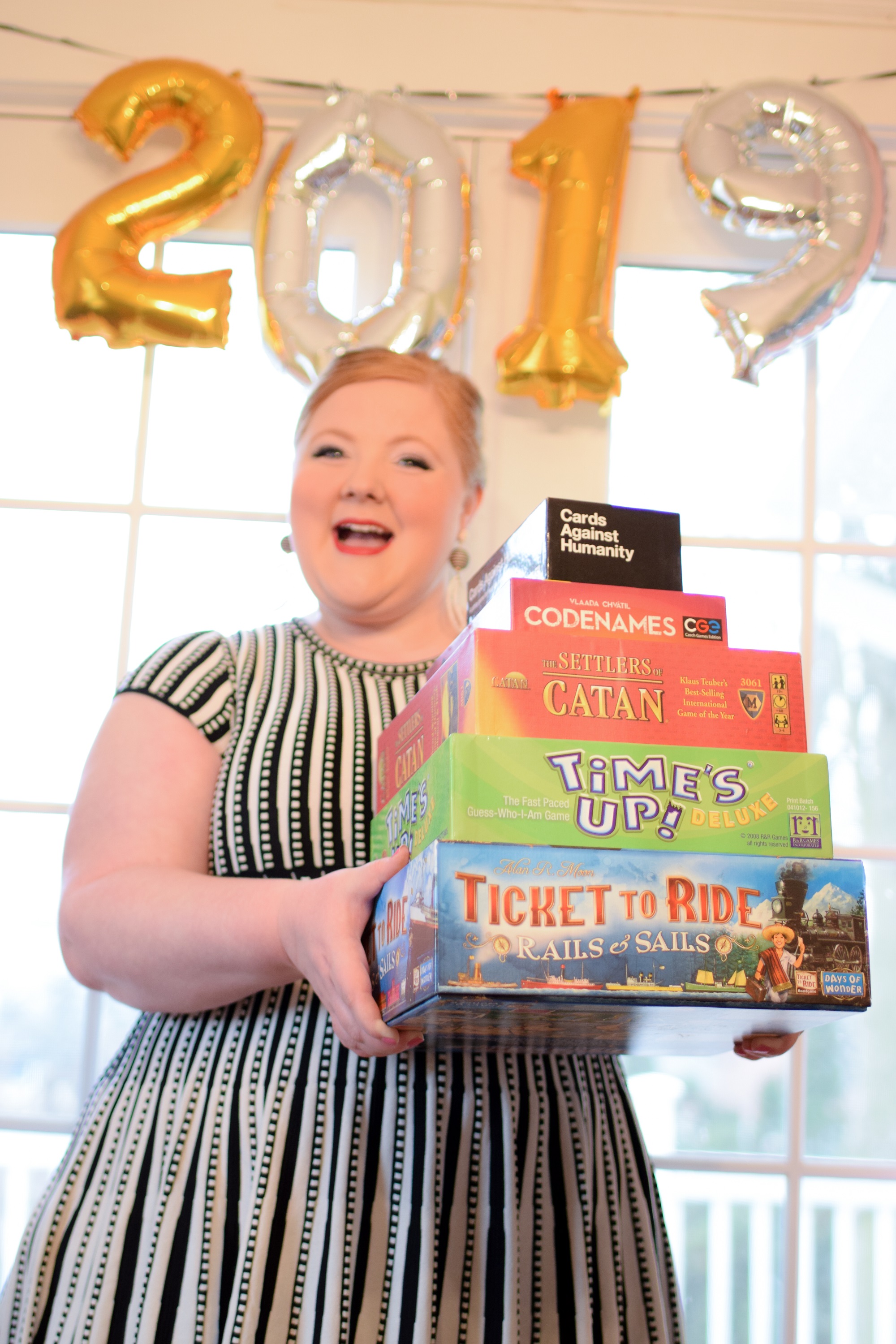 Best Group Party Games for New Year's Eve: Cards Against Humanity, Codenames, Catan, Time's Up, and Ticket to Ride: Rails & Sails are fun, silly, and smart.